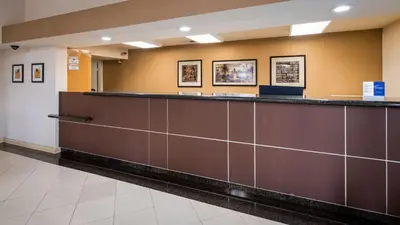 a waiting room at a hospital with a long counter at Best Western Norwalk Inn in Norwalk
