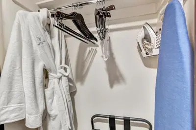 a bathroom with white towels hanging on a rack at Ocean View Hotel in Los Angeles