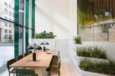 a conference room with a wooden table and chairs at W Hollywood in Los Angeles