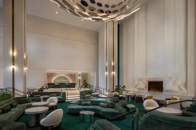 a lobby with couches and tables and a fireplace at W Hollywood in Los Angeles