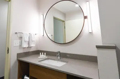 a bathroom with a sink and a mirror at Fairfield Inn & Suites Ontario Rancho Cucamonga in Rancho Cucamonga
