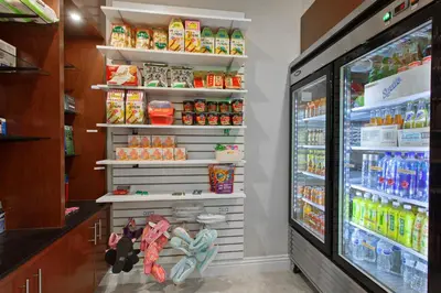 a store refrigerator filled with lots of food at Holiday Inn El Monte - Los Angeles by IHG in El Monte