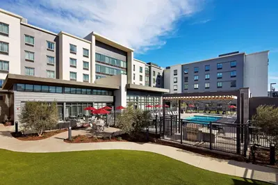 a view of a hotel with a swimming pool at Hampton Inn Long Beach Airport, Ca in Long Beach