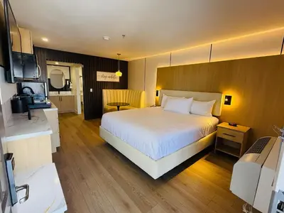 a bedroom with a large white bed in a room at MainStay Suites Victorville - Hesperia in Victorville