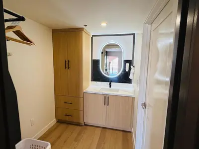 a bathroom with a sink and a mirror at MainStay Suites Victorville - Hesperia in Victorville