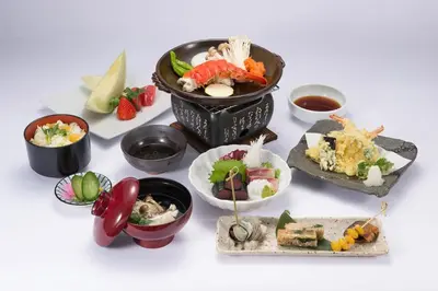 a group of bowls of food on a white table at Miyako Hybrid Hotel Torrance in Torrance