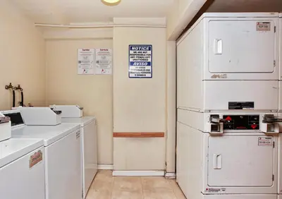 a kitchen with white appliances and a white refrigerator at Red Roof Inn Santa Ana in Santa Ana