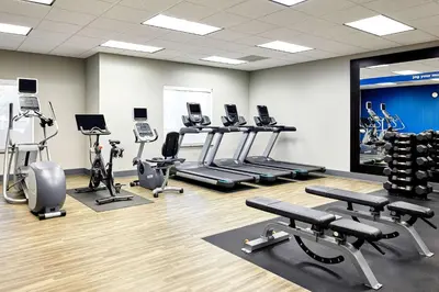 a gym with several treadmills and cardio machines at Hampton Inn & Suites Ridgecrest in Ridgecrest