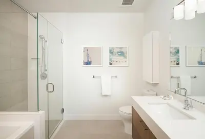 a white bathroom with a sink and a toilet at Luxurious Highrise 2b 2b Apartment Heart Of Downtown LA in Los Angeles