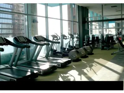 a gym with rows of cardio machines in a building at Luxurious Highrise 2b 2b Apartment Heart Of Downtown LA in Los Angeles