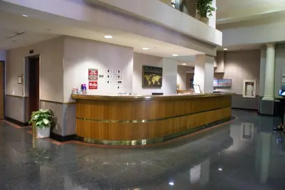 a large lobby with a bar in a building at Kawada Hotel in Los Angeles