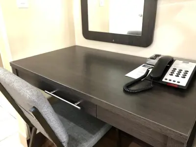 a telephone sitting on a desk in a room at Simply Home Inn & Suites - Riverside in Riverside