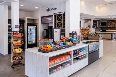 a grocery store aisle with food on display at Hilton Garden Inn Bakersfield in Bakersfield