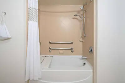 a bathroom with a shower and a bath tub at Hampton Inn and Suites Bakersfield / Highway 58 in Bakersfield