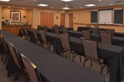 a conference room with black tables and chairs at Hampton Inn and Suites Bakersfield North-Airport in Bakersfield