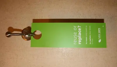 a sign attached to a wall with a door knob at Hampton Inn and Suites Barstow in Barstow