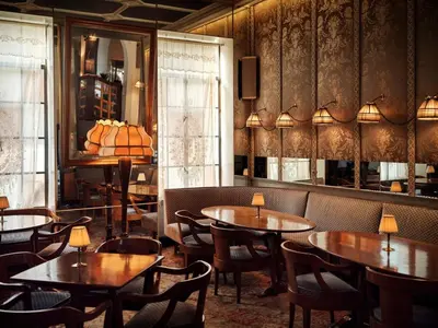 a restaurant with tables and chairs in a room at Chateau Marmont in Los Angeles