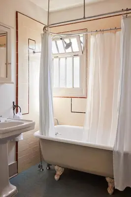 a bathroom with a white tub and a sink at Chateau Marmont in Los Angeles