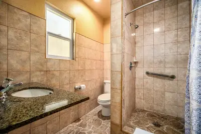 a bathroom with a sink and a toilet at Geneva Motel in Inglewood