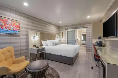 a hotel room with a bed and a television at Bluestem Hotel Torrance Los Angeles, an Ascend Collection Hotel in Torrance