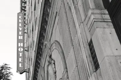 a black and white photo of the side of a building at The Culver Hotel in Los Angeles