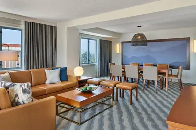 a living room with a couch and a dining room at The Westin Pasadena in Pasadena