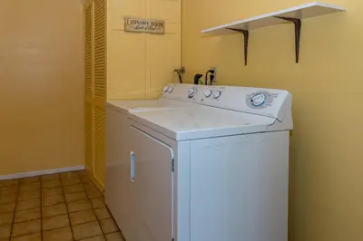 a white washer and dryer in a bathroom at Channel Island Shores in Oxnard