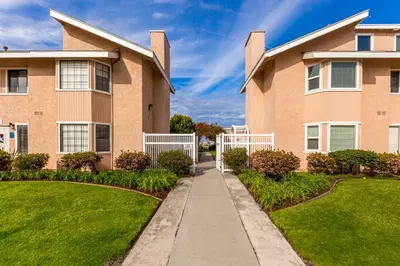 a house with a sidewalk in front of it at Channel Island Shores in Oxnard