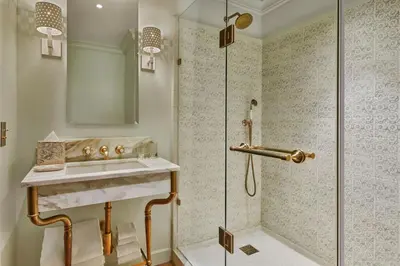 a bathroom with a sink and a shower at Hotel Per La, Autograph Collection in Los Angeles