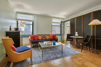 a living room with a couch and a table at Hotel Per La, Autograph Collection in Los Angeles