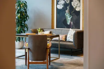 a living room with a couch and a table at Renaissance Los Angeles Airport Hotel in Los Angeles