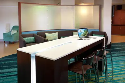 a desk with a laptop on it in a room at SpringHill Suites Los Angeles LAX/Manhattan Beach in Hawthorne