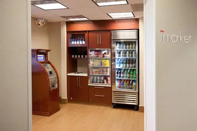 a room with a refrigerator and a drink cooler at SpringHill Suites Los Angeles LAX/Manhattan Beach in Hawthorne