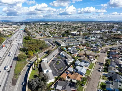 an aerial view of a city with a highway at The Buena Park Hotel & Suites in Buena Park