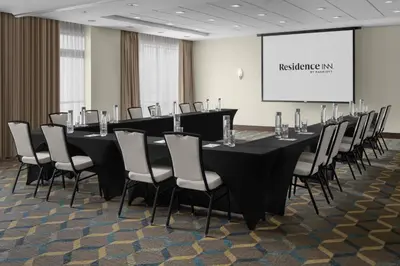 a conference room with a long table and chairs at Residence Inn Los Angeles Burbank/Downtown in Burbank