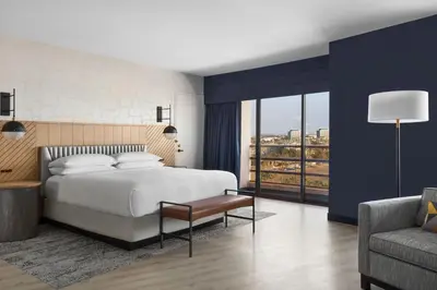 a bedroom with a large bed and a couch at Marina del Rey Marriott in Los Angeles
