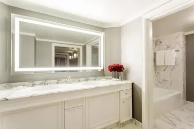 a bathroom with two sinks and a large mirror at The Ritz-Carlton, Marina del Rey in Los Angeles