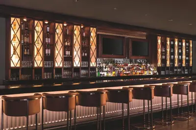 a bar with a row of bar stools at The Ritz-Carlton, Marina del Rey in Los Angeles