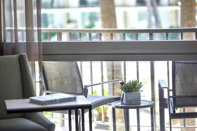 a laptop computer sitting on a table in front of a window at Los Angeles Airport Marriott in Los Angeles