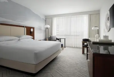 a hotel room with a bed and a desk at Marriott Long Beach Downtown in Long Beach