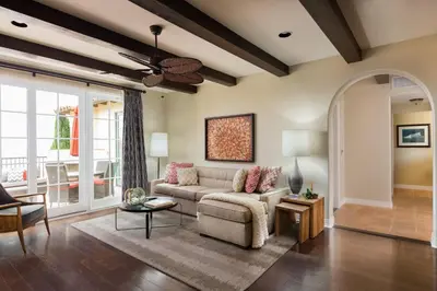 a living room with a couch and a table at Terranea Resort in Rancho Palos Verdes