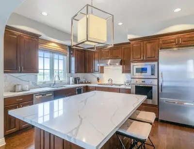 a large kitchen with a large marble counter top at Terranea Resort in Rancho Palos Verdes