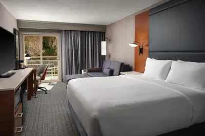 a hotel room with a large bed and a desk at Courtyard Los Angeles Century City/Beverly Hills in Los Angeles