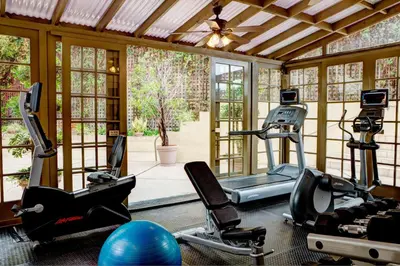 a gym with treadmills and exercise bikes in a room at Courtyard Los Angeles Century City/Beverly Hills in Los Angeles