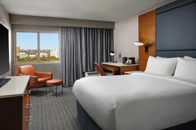 a hotel room with a bed and a desk at Courtyard Los Angeles Century City/Beverly Hills in Los Angeles