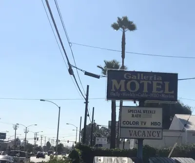 a sign for a motel on the side of a road at Galleria Inn Montclair/Ontario in Montclair