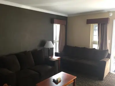 a living room with a couch and a table at Seaside Motel in Redondo Beach