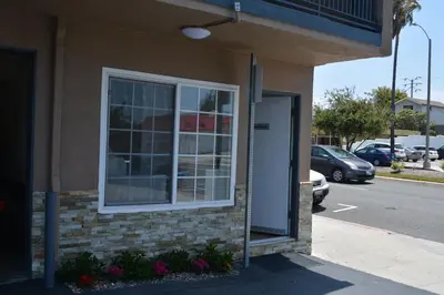 a window on the side of a building at Seaside Motel in Redondo Beach