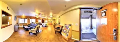a living room with a couch and a living room with a house at Snow Lake Lodge in Big Bear Lake