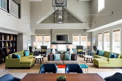 a lobby with couches and chairs and a tv at Residence Inn Los Angeles Torrance/Redondo Beach in Torrance